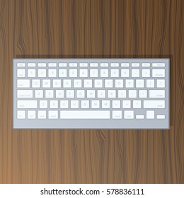 Bluetooth white realistic keyboard on a wood texture table. Modern computer peripheral gadget. QWERTY isolated vector illustration art.