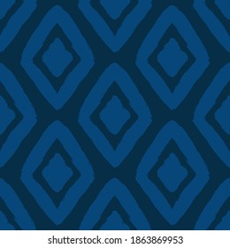 Bluish ink rhombuses isolated on dark blue background. Monochrome geometric seamless pattern. Vector flat graphic hand drawn illustration. Texture.