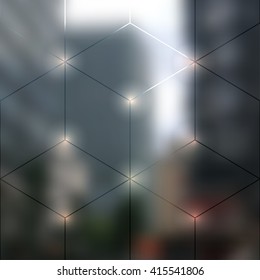 Blur lights city background with a lines of geometric cubes.