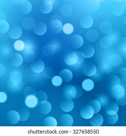 Blurred abstract background with blue and white bokeh