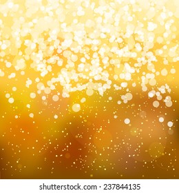 Blurred abstract background with golden lights. EPS10 file. Gradient mesh and transparency effects used.