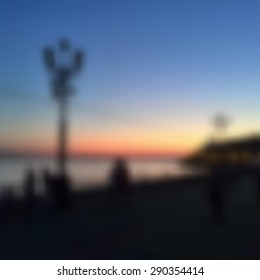 blurred abstract background sunset on the waterfront. free space for text