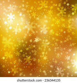 Blurred abstract winter background with golden lights and snowflakes. EPS10 file. Gradient mesh and transparency effects used.