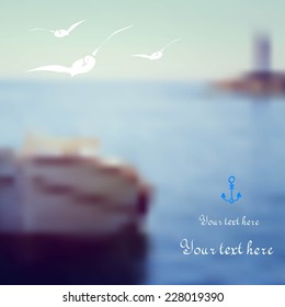 blurred background with boat, lighthouse, gulls