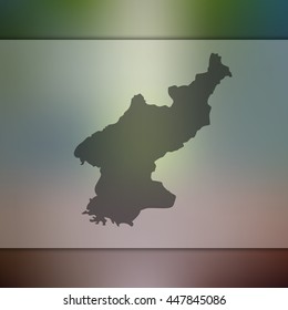 Blurred background with silhouette of North Korea map. Vector silhouette of North Korea map