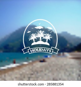Blurred background with Summer holidays logo