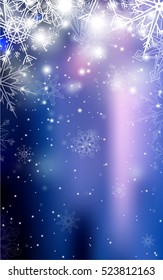 Blurred blue Christmas winter background with sparkles and snowflakes.