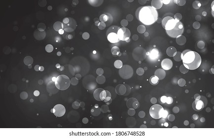 Blurred bokeh light on black background. Christmas and New Year holidays template. Abstract silver glitter defocused blinking stars and sparks. Vector EPS 10