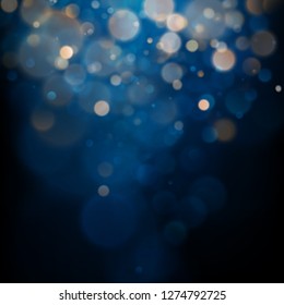 Blurred bokeh light on dark blue background. Christmas and New Year holidays template. Abstract glitter defocused blinking stars and sparks. EPS 10