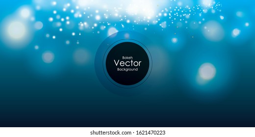 Blurred bokeh light on dark blue background. Christmas and New Year holidays template.