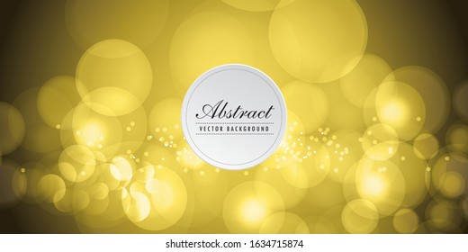 Blurred bokeh light on dark yellow background. Christmas and New Year holidays template.