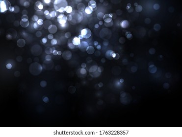 Blurred bokeh light on dark blue background. Christmas and New Year holidays template. Abstract glitter defocused blinking stars and sparks. Vector EPS 10