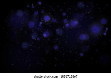 Blurred bokeh light on dark background. Christmas and New Year holidays template. Abstract glitter defocused blinking stars and sparks. 