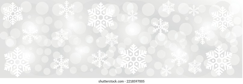 Blurred Christmas lights with snowflakes on grey background