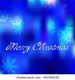 blurred dark blue background with snowflakes Christmas