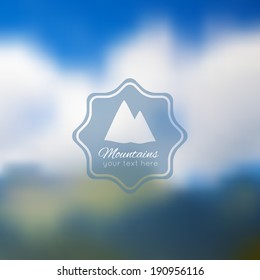 Blurred nature background. Mountains and sky.