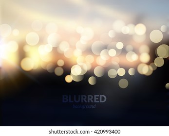 Blurred nature landscape with bokeh lights effect. Sunset background.