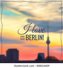 Blurred Prague background made with mesh. Sunset over Alexanderplatz in Berlin, text "I love Berlin", copy-space.