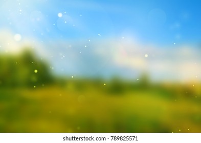 Blurred sunny spring or summer landscape. Nature background with green field, blue sky and sunlight. Vector.