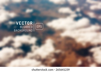 Blurred vector background. For design. Clouds, earth and a top view of the field. gradient mesh. Editable. Unfocused.