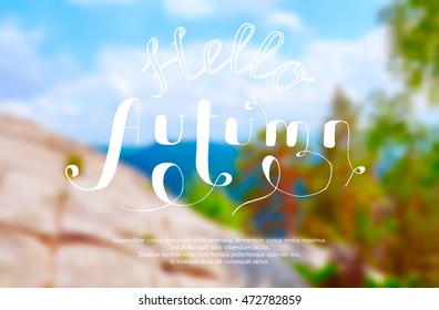Blurred Vector Background. Seasonal Design. Created hand caption "Hello Autumn!"