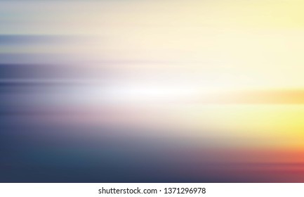 Blurred yellow-blue background. Light sky and sea landscape.