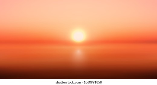Imagen de fondo borrosa del círculo del sol que se eleva tras un horizonte oscuro sobre nubes naranjas de fondo. Resumen Bokeh del Sol cayendo a través de las nubes en el horizonte
