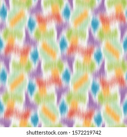 Blurry fuzzy blobs of color seamless repeat vector pattern swatch. Modern ikat style for background or surface design. Bright colors on white.