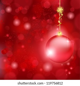 Blurry lights on dark red background and a red bauble hanging with a golden bow. Great backdrop for Christmas themes. Space for your text.
