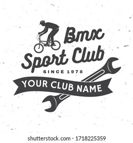 Bmx extreme sport club badge. Vector illustration. Concept for shirt, logo, print, stamp, tee with man ride on a sport bicycle. Vintage typography design with bmx cyclist and wrench silhouette.