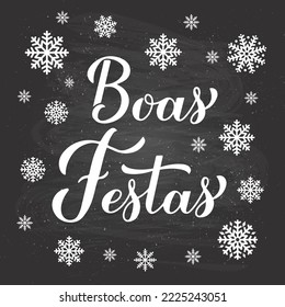 Boas Festas calligraphy hand lettering on chalkboard background with snowflakes. Happy Holidays in Portuguese. Christmas and Happy New Year typography poster. Vector template for greeting card, etc.