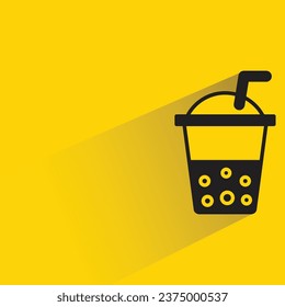 boba tea cup with shadow on yellow background