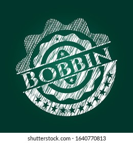 Bobbin chalk emblem written on a blackboard. Vector Illustration. Detailed.