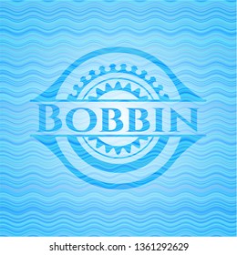 Bobbin light blue water style badge.