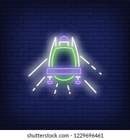 Bobsledder neon sign. Glowing inscription of bob with driver on dark blue brick background. Can be used for sport, winter games, Olympic