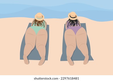 Body positivity. Two happy overweight women, on the beach on towels by the sea