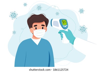 Body temperature check, man is being checked with infrared thermometer.