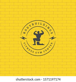 Bodybuilder man logo or badge vector illustration male bodybuilding symbol silhouette. Retro typography fitness emblem design template or t-shirt print.