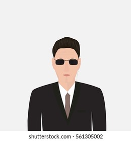 Bodyguard in a black suit with glasses on a light background, the security service