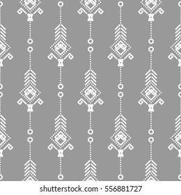 Bohemian seamless vector pattern. White on gray tileable navajo background.
