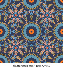 Bohemian style background in violet, blue and orange colors. Vector decorative floral embroidery seamless pattern, ornament for textile, kerchief, pillow or handbag decor.