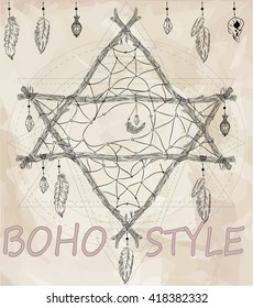 Boho dreamcatcher star with feathers.