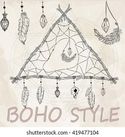 Boho dreamcatcher triangle with feathers.