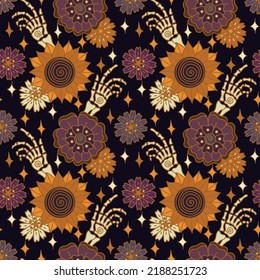 Boho Halloween bones and fall groovy flowers vintage magic seamless pattern. Skeleton hand brush and sunflowers vector illustration in retro 70s style. 