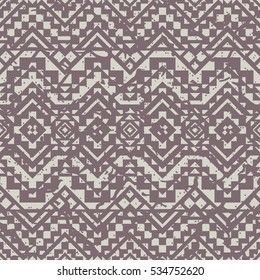 Boho seamless pattern with tribal aztec ornament and shabby effect.
