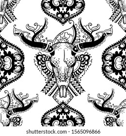 Boho seamless pattern with a wild buffalo skull in henna tattoo art style. Indian ornaments.