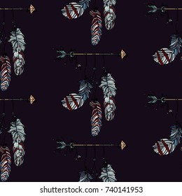 Boho stile. Seamless pattern with hand drawn dreamcatcher with athnic arrow and beautiful feathers on dark background.