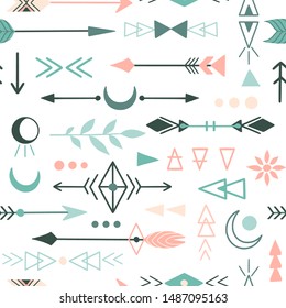Boho style hand drawn seamless pattern: arrows, moon phases, Aztec geometric shapes, magic texture for textile, paper. Doodle free hand symbols. Tribal decorative elements. Ethnic background. Vector