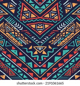 Boho style seamless pattern with hand drawn ethnic motif elements. Aztec stylized ornament with shabby vintage effect.
