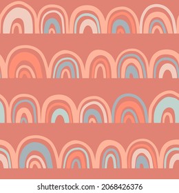 Boho style Seamless pattern with rainbows in doodle style in a natural color palette. Pastel naive nursery print design on a terracotta background. Hand drawn trendy contemporary kids backdrop.